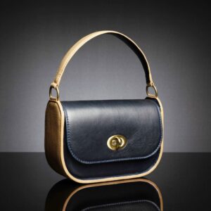 Luminara leather handbag displayed with its fixed strap, ideal for arm carrying, showcasing smooth full-grain leather and elegant stitching.