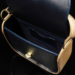 Interior of the Luminara leather handbag, showing a spacious compartment, cardholder, and beautiful lining.