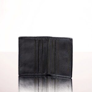Elegant black leather bifold mini purse, featuring fine stitching and a minimalist design, ideal for everyday use.
