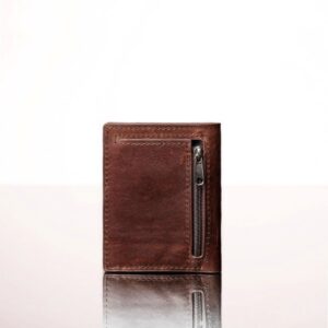 Close-up of a rich brown leather mini purse, featuring a refined bifold design with embossed branding and premium craftsmanship.