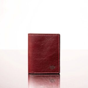 Women's ruby red leather bifold mini purse, handcrafted full-grain leather, compact and stylish for storing cards and essentials.
