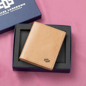 Elegant tan leather Gizelle bifold purse in a premium Charles Lansdown gift box, blending luxury craftsmanship with practical storage solutions.