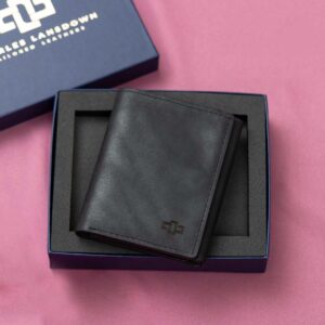 Women's black leather Gizelle trifold purse, beautifully displayed in a Charles Lansdown gift box, designed with a secure trifold layout and premium craftsmanship.