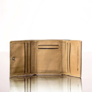 Inside compartments of a tan leather trifold purse, showcasing multiple card slots, a coin pouch, and bill storage.