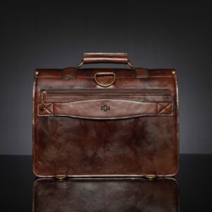 Back view of Benjamin Classic Laptop Bag in vintage brown leather, featuring a back zipper for easy access and a luggage strap for secure suitcase attachment.