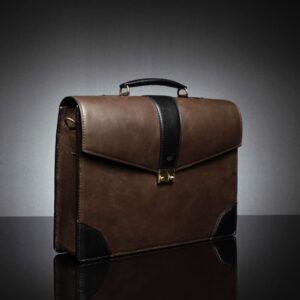 Side profile of the Svelte Laptop Bag, showing its slim design and elegant black leather edges.