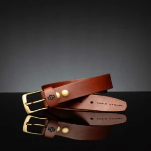 Rich tan leather belt, 35mm wide, featuring an antique brass buckle for a vintage touch.