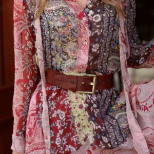 Women’s rich tan leather belt, 50mm wide, styled as a waist belt over a dress for a versatile look.