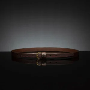 Slim brown leather belt for women, 20mm wide, ideal for layering with coats and blazers.