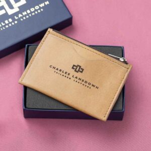 Luxury tan leather zipped cardholder in a stylish gift box, designed for elegance and functionality.