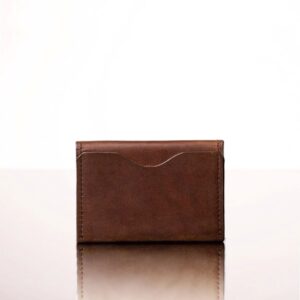 Smooth rich brown bifold leather cardholder for women, featuring minimalist design and durable craftsmanship.