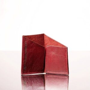 The Arabella Geometric Cardholder in ruby red, crafted from genuine leather with a clean, modern shape for easy access.