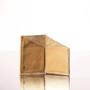 Designed for effortless style, this tan leather cardholder features a unique folded pocket for easy, secure storage.