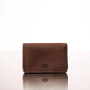 Women's rich brown leather cardholder pouch, minimalist and practical, handcrafted with an expanding pocket for extra card storage.