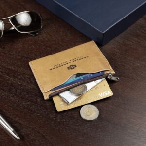 Dakota cardholder in tan leather with a zip compartment, emphasizing secure and organized card and coin storage.