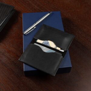 Luxury men’s black leather cardholder on a textured background. A refined and minimalist piece by Charles Lansdown.