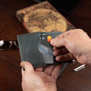 Elegant men’s Dakota Bifold Cardholder in denim blue, featuring premium leather, curved slots, and timeless craftsmanship.