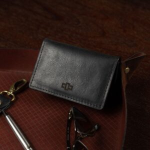 Men’s Harrington Pouched Cardholder in black. Handcrafted leather with an expanding pouch for cards and essentials.
