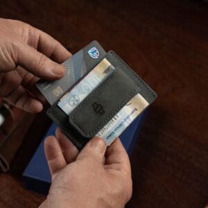Close-up of the Belvoir Streamline Moneyclip Cardholder’s strong magnetic clasp, securely holding folded notes.