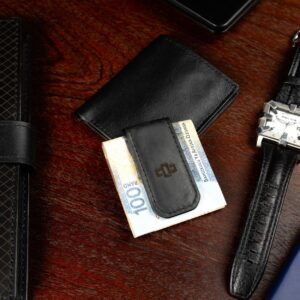 Black Belvoir leather money clip on a luxury surface, showcasing its durable craftsmanship and compact, lightweight design.