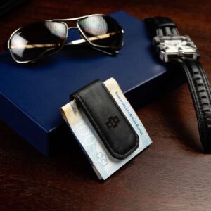Minimalist black leather money clip with a subtle embossed logo, ideal for men who prefer a stylish and practical wallet alternative.