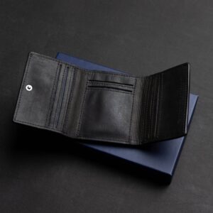 Mens trifold wallet in black genuine leather, Ashford model, shown open emphasizing its refined and durable interior.