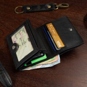 Mens trifold wallet in black genuine leather, Ashford model, displayed open showing multiple slots for cards and cash.