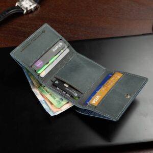 Mens trifold wallet in denim blue genuine leather, Ashford model, shown open with multiple card slots and a minimalist design.